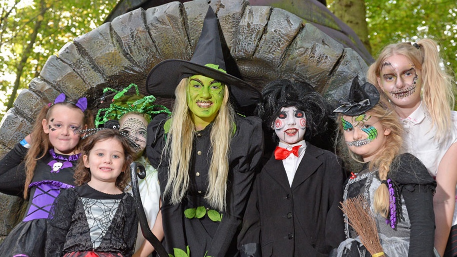 stockeld park halloween witch with green face with children face painted.
