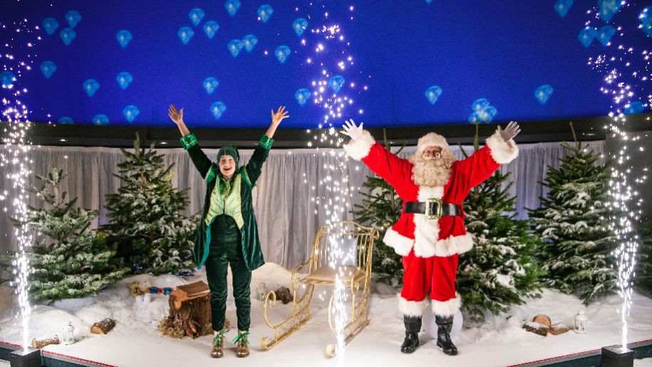 Santa Claus and elf at Winchester science centre Christmas show.