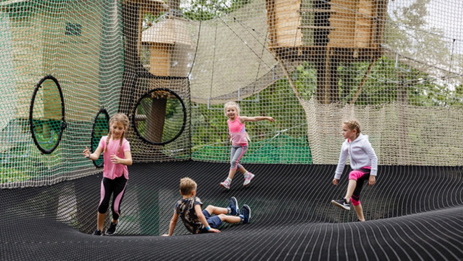 children bouncing on trampoline