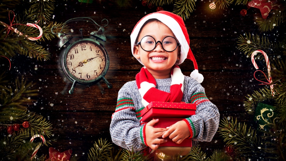 child with christmas present