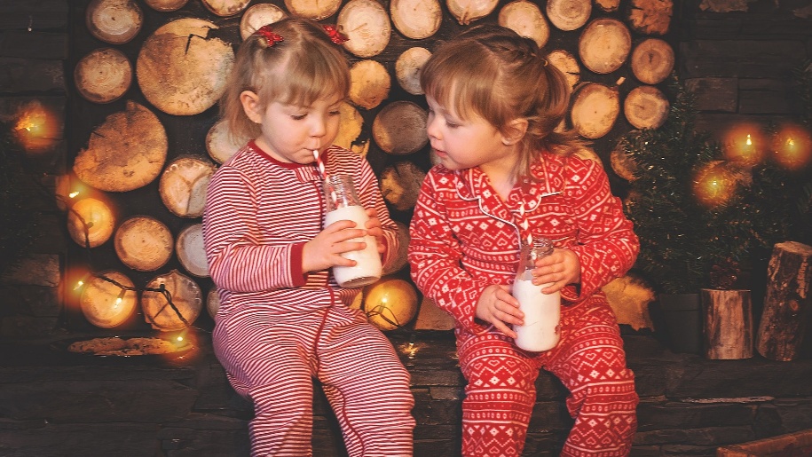 two girls with milk at christmas