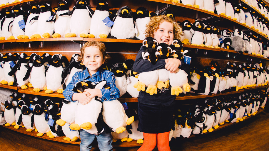 children with cuddly penguins