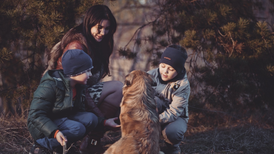 family with dog outdoors