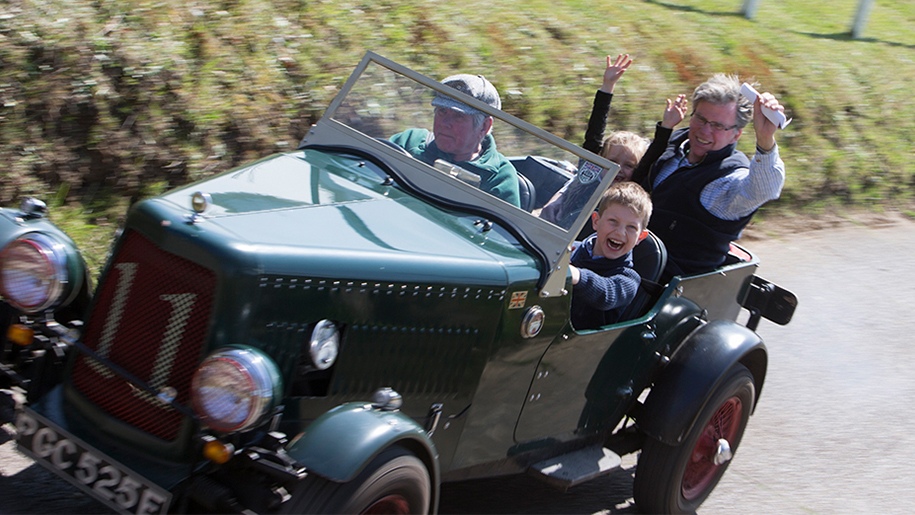 family in vintage car