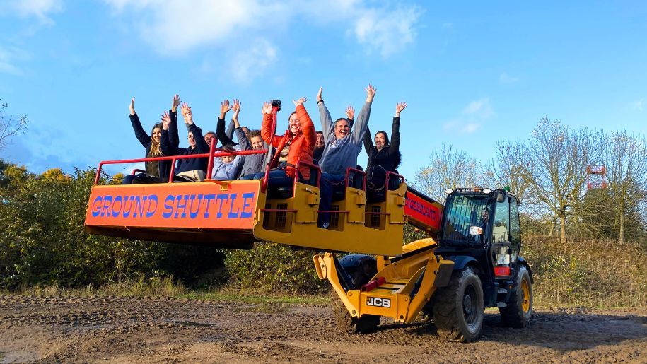 Muiple people riding the GROUND SHUTTLE at Diggerland