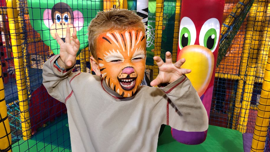boy with tiger face paint at Gambado