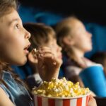 shutterstock girl at cinema image