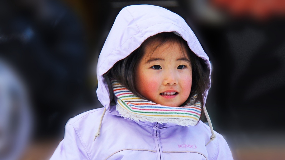 Child in winter clothing.