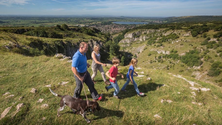 Family walking at Cheddar Gorge in Somerset.