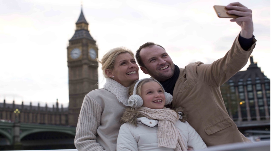 family taking a picture in front of Big Ben London