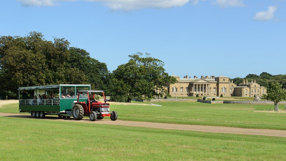 Holkham tractor and trailer in front of main house 915x515