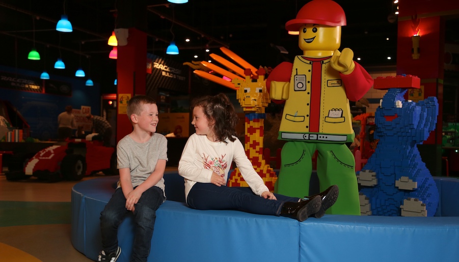 Legoland Discovery Centre Manchester big yellow man and two children