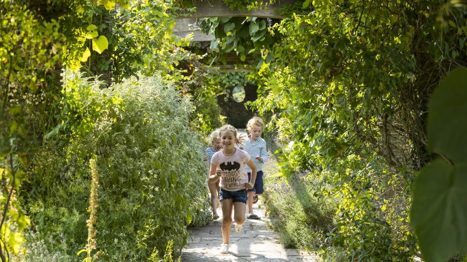 Children running along a path at Hestercombe Gardens in Somerset.