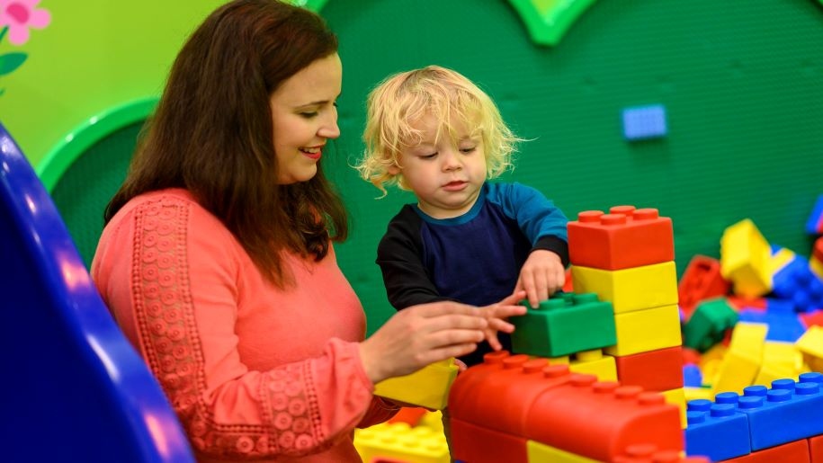 mum and boy with play bricks Legoland Discovery centre