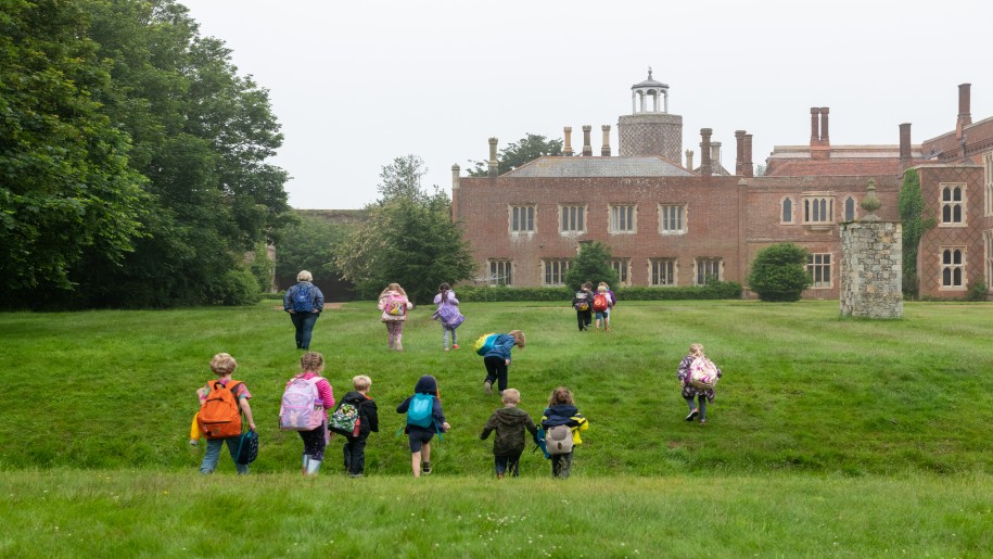 Priory Education Centre Essex - Children running up grassy hill