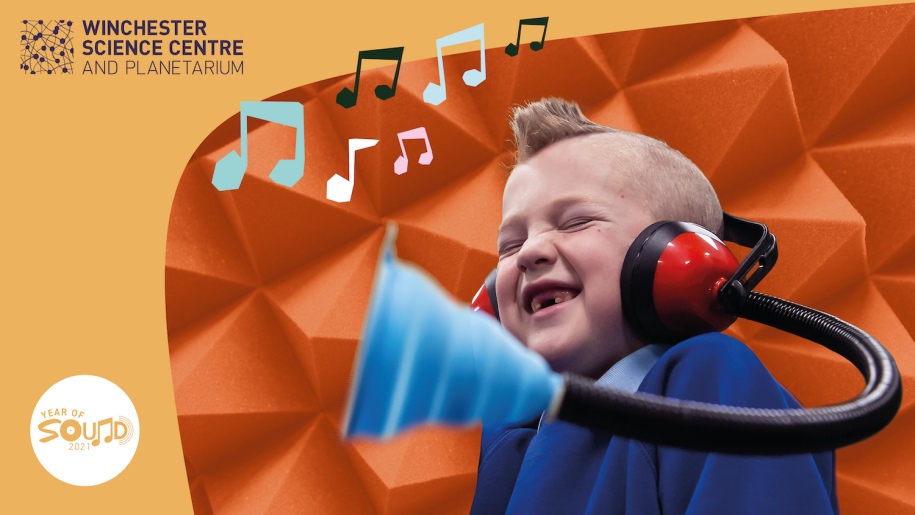 Winchester Science Centre - Young boy listen to music with headphones on