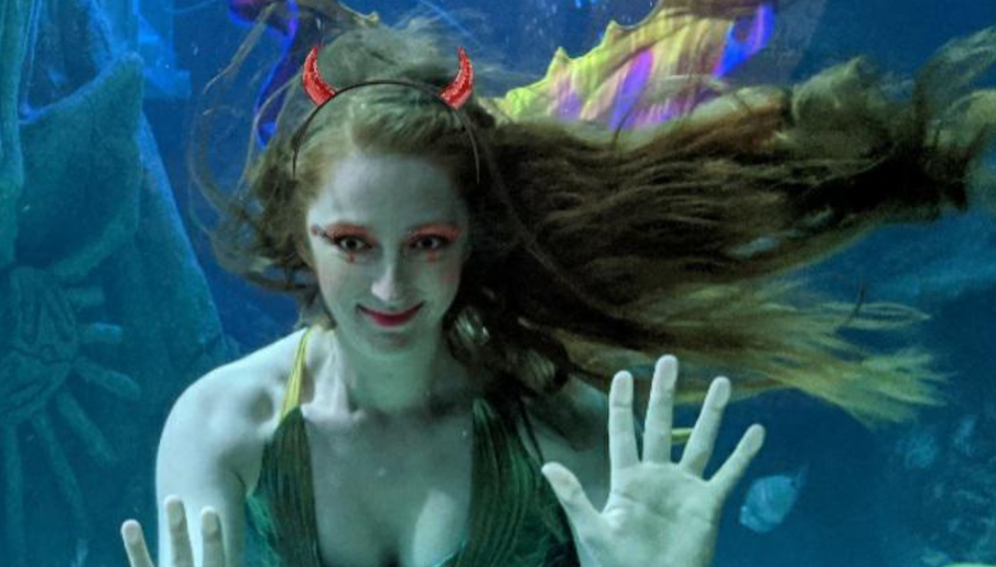 Sea Life Manchester mermaid waving underwater