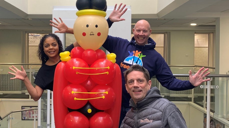 Balloon sculpture with staff at Echells Wellbeing Centre