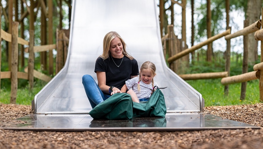 Mum and girls on big slide BeWILDerwood Cheshire