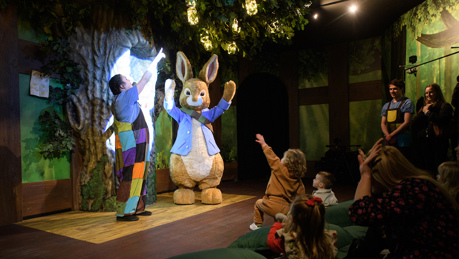 Peter Rabbit on stage with lady