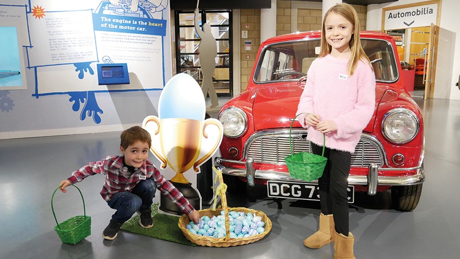 Children with basket of Easter eggs at the British Motor Museum.