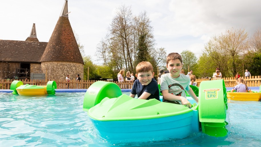 Kent Life - two boys in a paddle boat