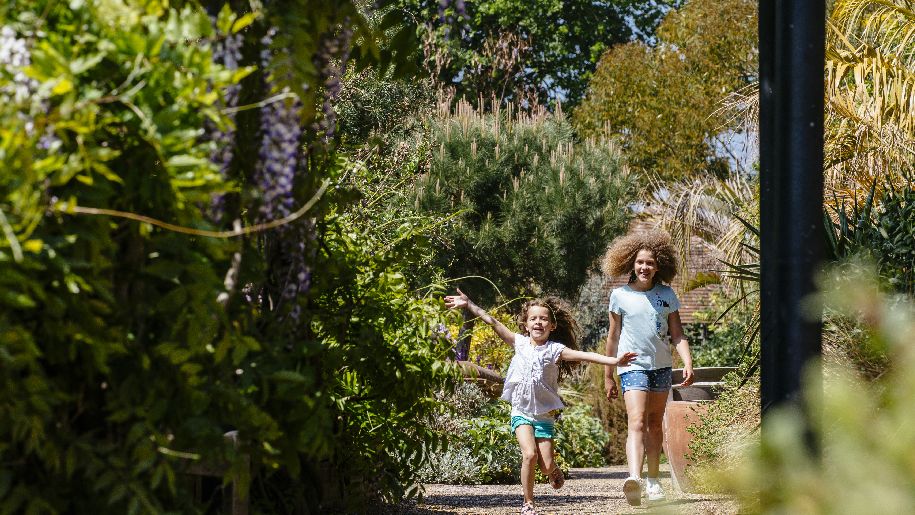 Leeds Castle - two girls walking through the gardens