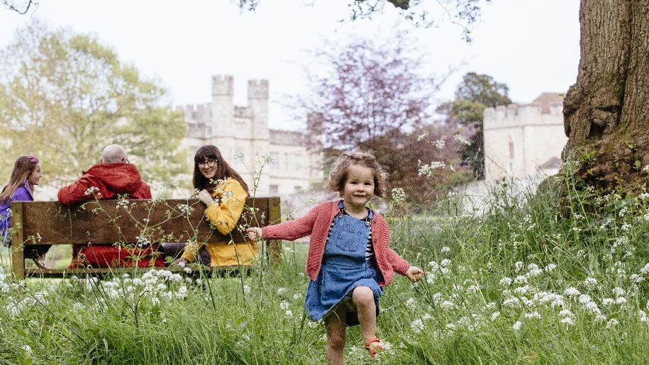 Leeds Castle - small child running through cowslips
