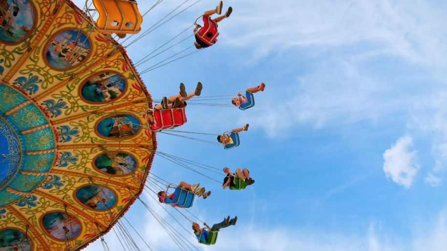 kids at circus carnival giant swing ride