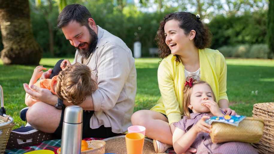 family laughing at picnic
