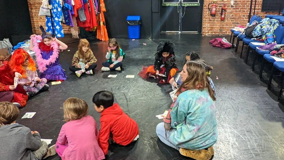 Yvonne Arnaud Theatre Children sitting in circle in dress up clothing