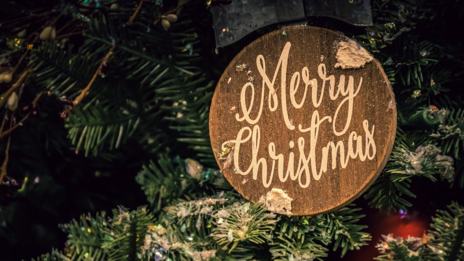 Wooden ornament on a Christmas tree.