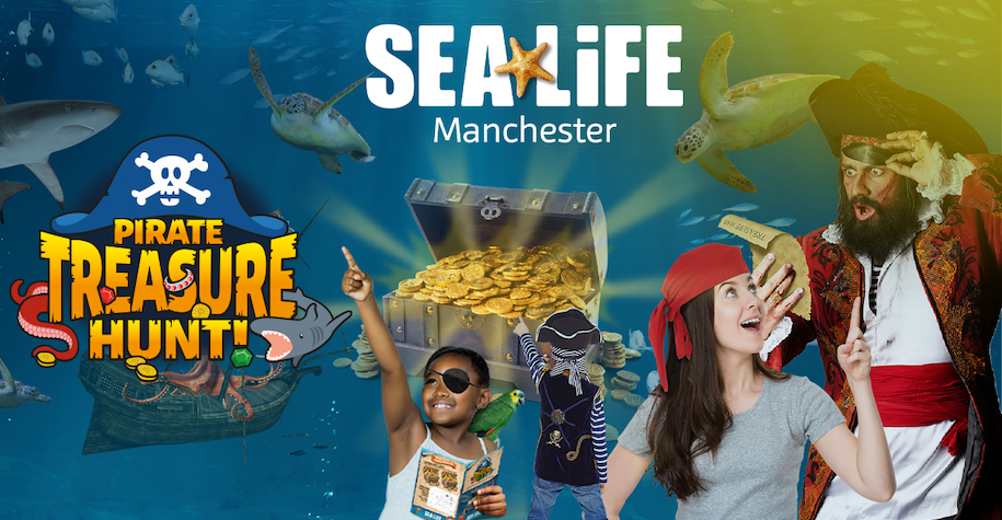 Sea Life Manchester Pirate event with boy with eye patch pirate and lady wearing red head scarf