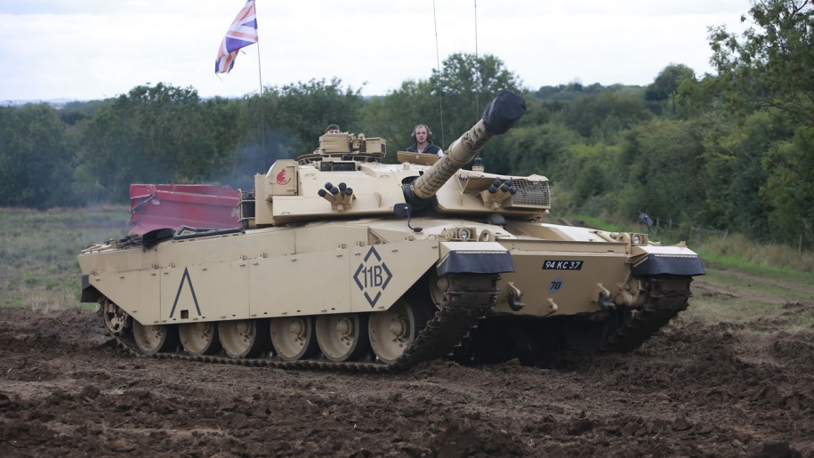 tank with Union flag in a muddy field