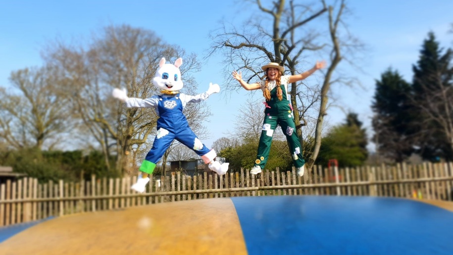 Easter bunny character and friend bouncing on a jumping pillow at Lower Drayton Farm.