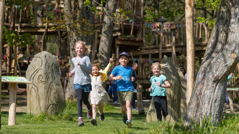 Children running at Tumblestone Hollow adventure playground.