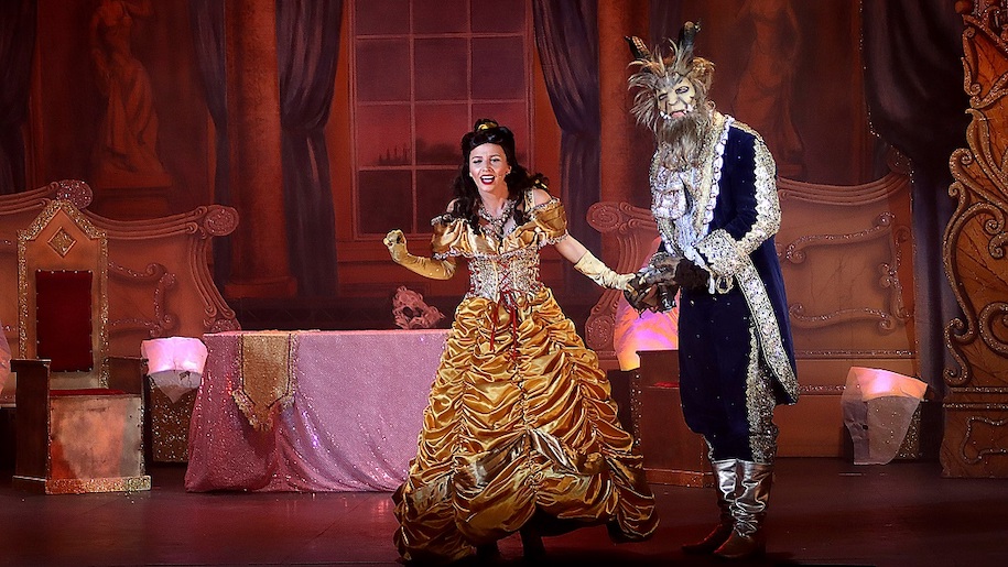 Beauty & the Beast princess wearing gold gown with Beast photo by Davis Munn