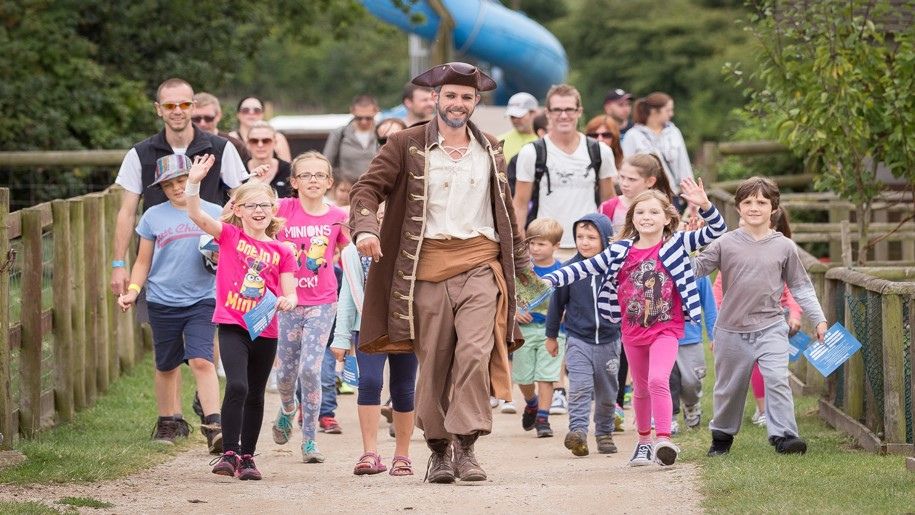 Pirate leading a group of children and parents at Hatton Adventure World 