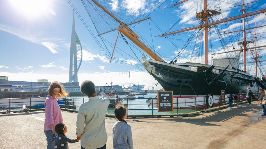 A family at the Portsmouth Historic Dockyard docks