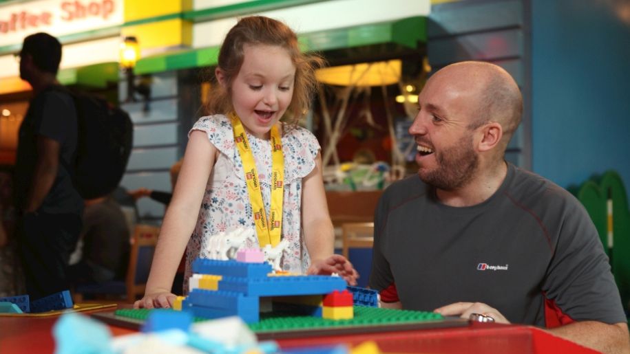 Child and Father playing with bricks at LEGOLAND Discovery Centre