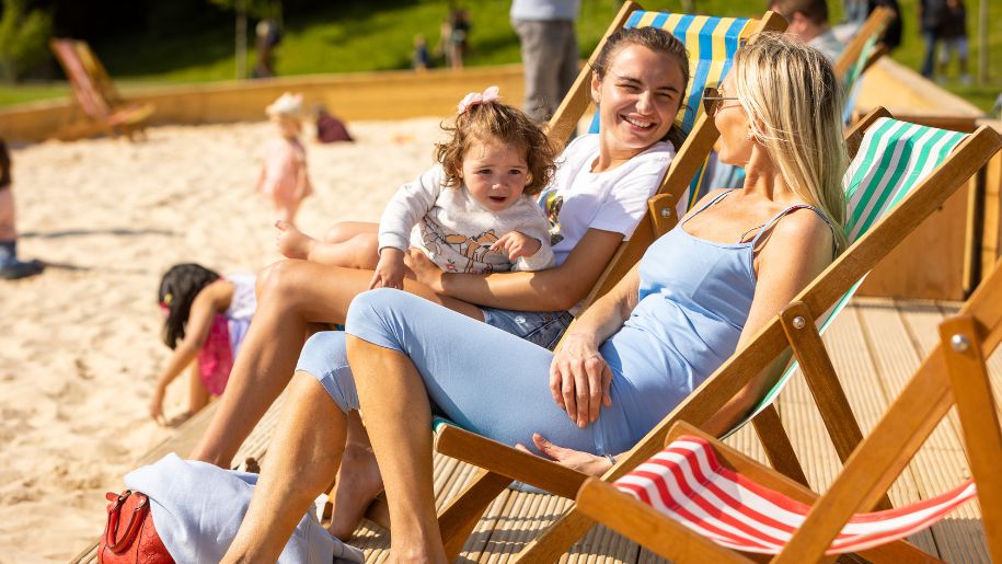 Two women sat on the beach at Leeds Castle