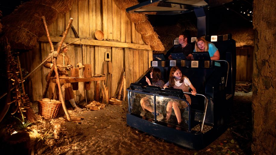 Family riding an immersive carriage ride at JORVIK