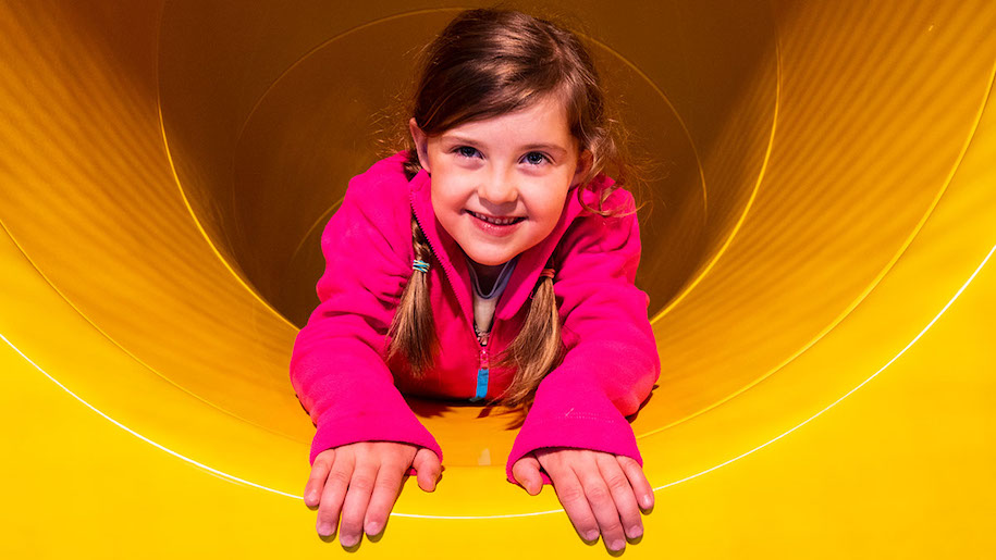 Girls in yellow tunnel at Ashbourne soft play