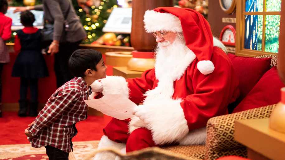Boy talking to Santa Claus