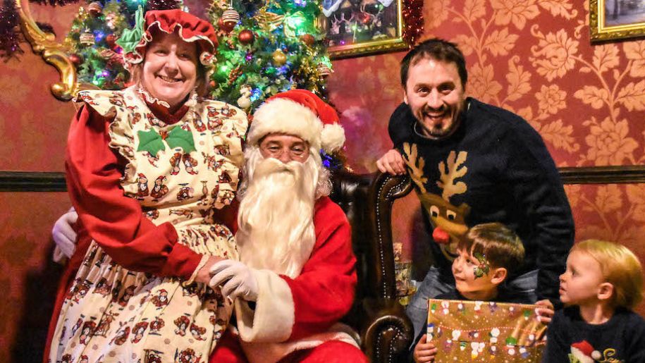 Family posing with Santa at Sundown Adventureland 