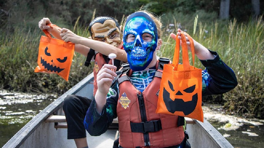 New Forest Activities People in a boat with Halloween bags