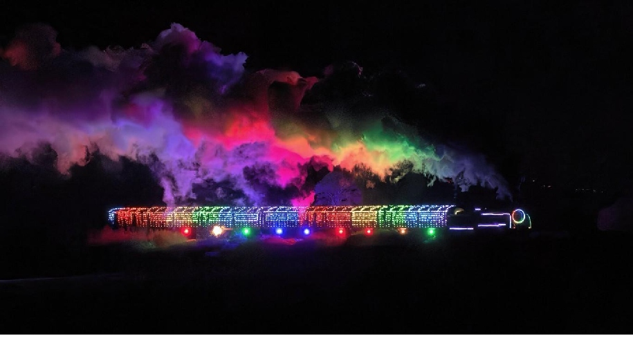 Watercress Line Steam Illuminations event with picture of train lit up in the dark