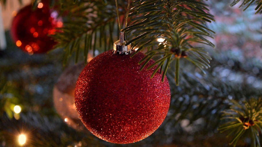 Generic Christmas red ball decoration hanging in tree