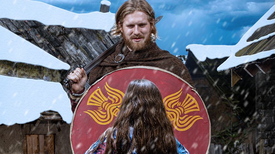 A Viking and young girl in the snow at JORVIK Viking Centre