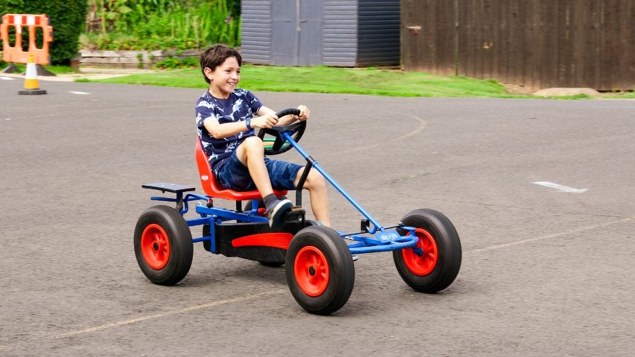 A child in a pedal kart at SuperCamps.
